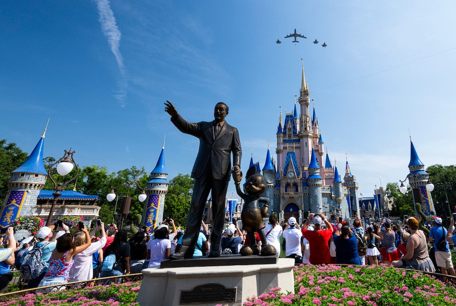 A squadron of elite F-35 stealth fighter jets raced across the sky over the Castle with Walt Disney and Mickey Mouse statue in center view