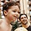A father holding an inner tube and his son wearing swim trunks stand beside a rock at Aulani Resort
