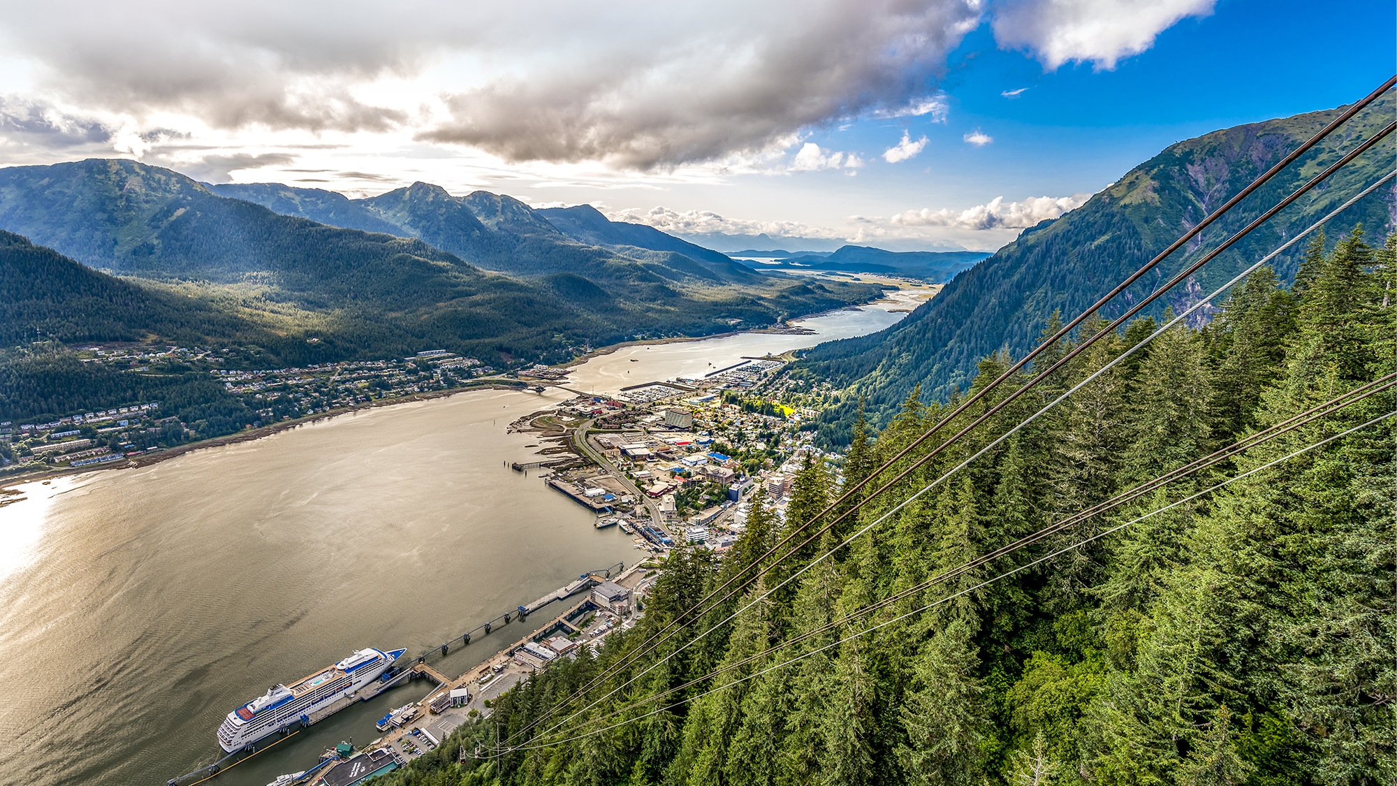 A view from high above, a cruise ship docs at the port of call and state capital of Alaska, Juneau 