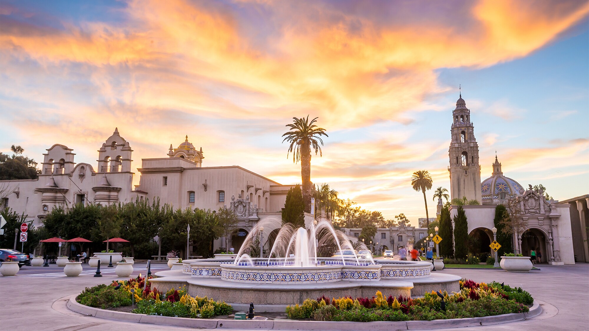 A bed of flowers surrounds a fountain in Balboa Park in San Diego, California