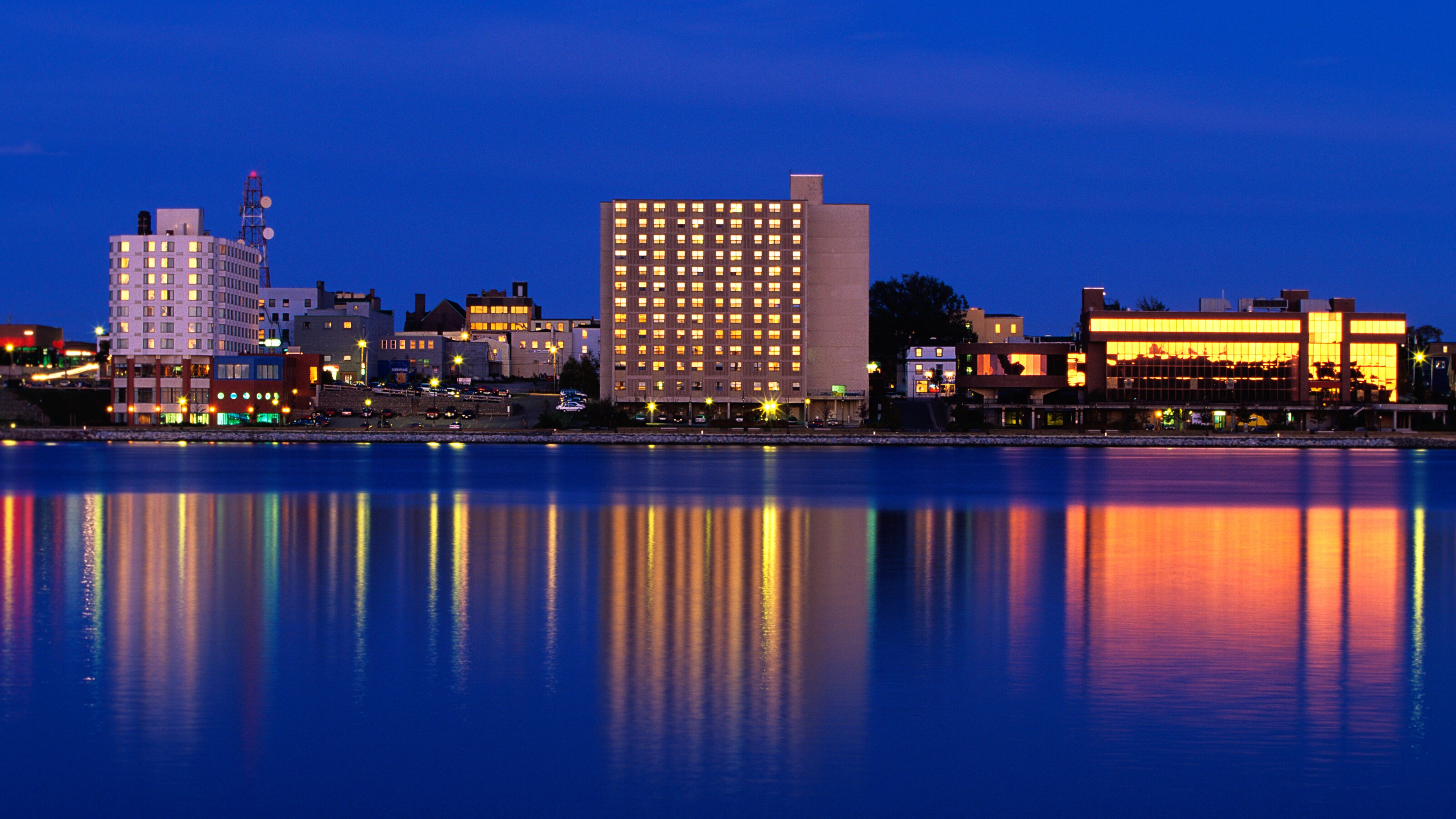 Hotels along the waterfront at night, in Sydney Canada