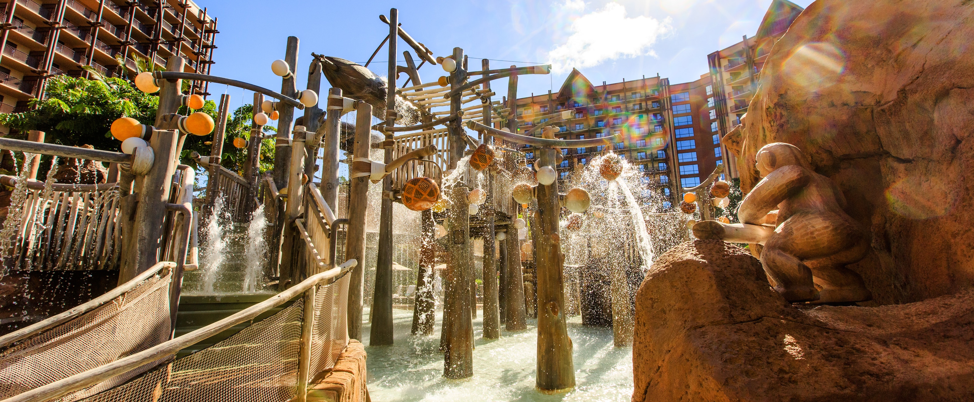 Photos Videos Aulani Hawaii Resort Spa Water Spills Down From The Menehune Bridge As Resort S Rooms And Suites Tower In