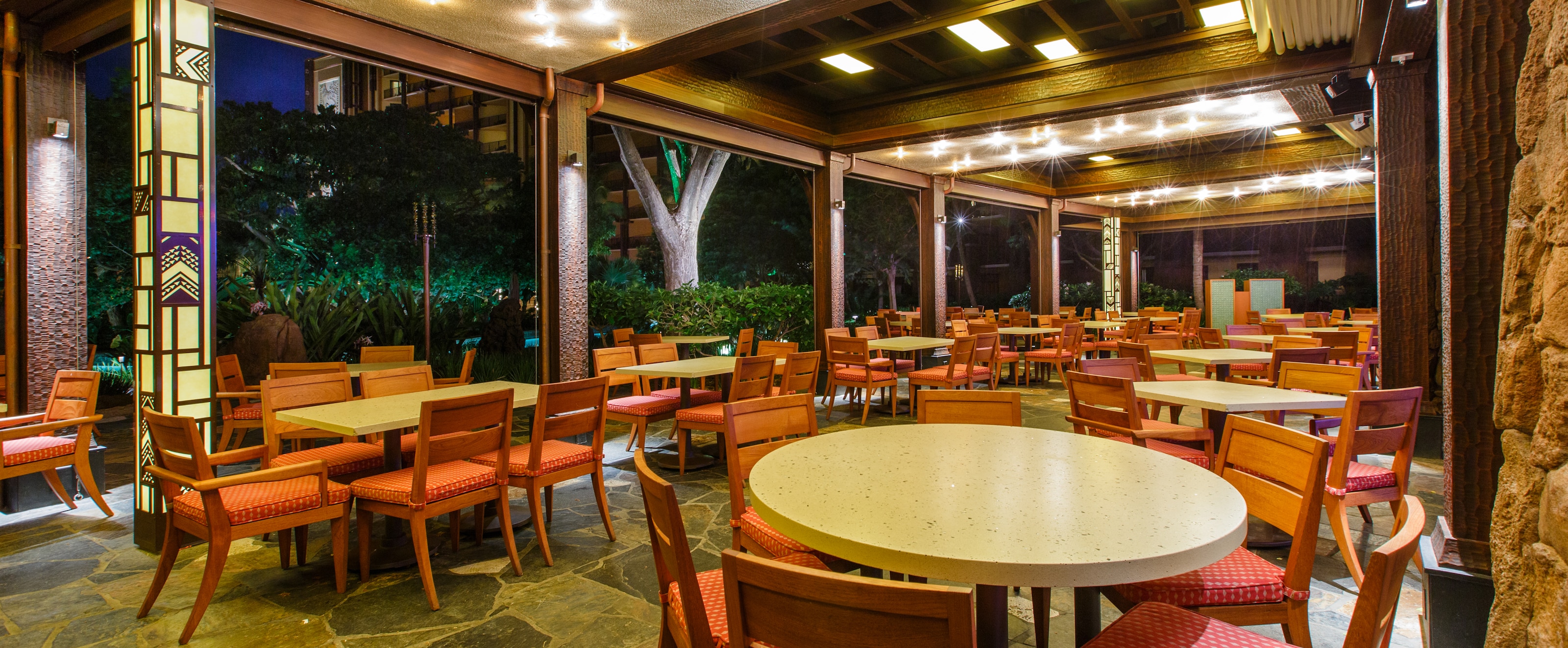 Makahiki Buffet Dining Aulani Hawaii Resort Spa Tables On A Large Covered Patio Lit Up At Night