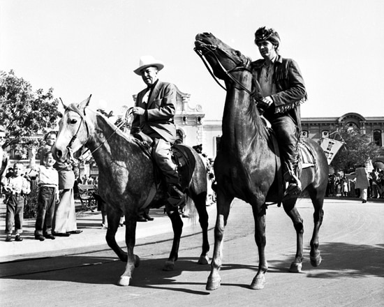 Fess Parker riding horses with Walt Disney
