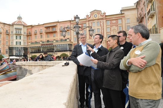 Tom Staggs visits Mediterranean Harbor during a Tokyo DisneySea park tour.  In the photo (from left to right) are Dave Vermeulen, VP & Executive Managing Director, Walt Disney Attractions Japan, Tom Staggs, Daniel Jue, Director, Design and Production, Tokyo Disney Resort, Walt Disney Imagineering Japan, Jim Hunt, EVP/CFO, Walt Disney Parks & Resorts, Bill Earnest, President and Managing Director, Asia, Walt Disney Parks & Resorts and Craig Russell, Chief Design & Project Delivery Executive, Walt Disney Imagineering.