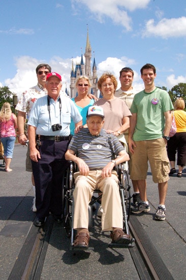 John Schmitz and family celebrating his 100th birthday at Magic Kingdom Park