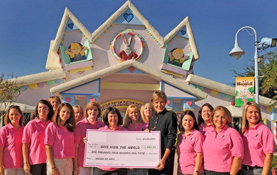 Walt Disney World Moms Panelists Present Donation to Give Kids The World Village