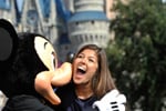 Miss California 2010 Arianna Afsar, of San Diego, Calif., meets Mickey Mouse at the Magic Kingdom.