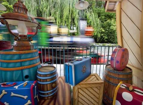 Toon-Looking Luggage at the Toontown Depot as a Train Speeds Past, By: Paul Hiffmeyer