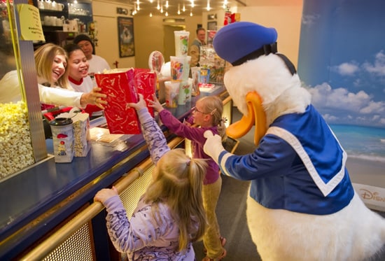 Disney VoluntEARS Serving Movie Snacks and Popcorn'