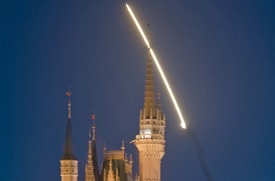 Space Shuttle Discovery Soars Over Cinderella Castle at Walt Disney World