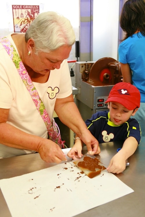 Guests mold a delicious chocolate treat during a Port Adventure in Barcelona