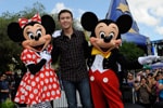 (MAY 30, 2011): Newly crowned 'American Idol' Scotty McCreery poses May 30, 2011, with Mickey and Minnie Mouse in front of 'The American Idol Experience' attraction at Disney's Hollywood Studios in Lake Buena Vista, Fla. McCreery was honored in a parade at the Disney theme park and performed his new song, 'I Love You This Big.' On Wednesday, the 17-year-old singer was crowned the new 'American Idol' on the season finale which was viewed by an estimated 29.3 million people. (Gene Duncan, photographer)
