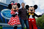 (MAY 30, 2011): Newly crowned 'American Idol' Scotty McCreery poses May 30, 2011, with Mickey and Minnie Mouse in front of 'The American Idol Experience' attraction at Disney's Hollywood Studios in Lake Buena Vista, Fla. McCreery was honored in a parade at the Disney theme park and performed his new song, 'I Love You This Big.' On Wednesday, the 17-year-old singer was crowned the new 'American Idol' on the season finale which was viewed by an estimated 29.3 million people. (Matt Stroshane, photographer)
