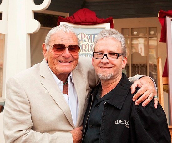  Rolly Crump (left) and Chris Crump (right) at the 2009 dedication of a Main Street, U.S.A., window in Rolly's honor.