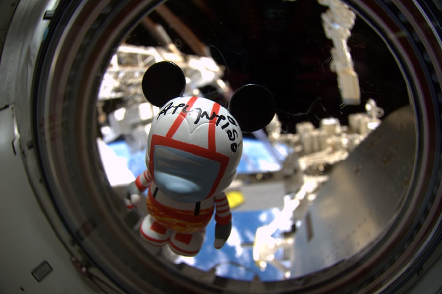 The customized Mission:SPACE-inspired Vinylmation floats inside Space Shuttle Atlantis