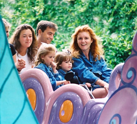 Sarah, Duchess of York, Princess Beatrice and Princess Eugenia on Alice in Wonderland at Disneyland Park in 1995
