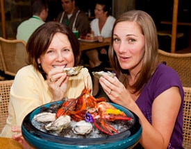 Erin and Pam savor the briny New Zealand oysters from Off the Hook’s 'Feast of the Sea' platter.
