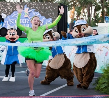 Kellie Nickerson (1:27:52), from Albuquerque, N.M., crosses the finish line to win the 2012 Tinker Bell Half Marathon at Disneyland Resort in Anaheim, Calif., on Jan. 29, 2012.