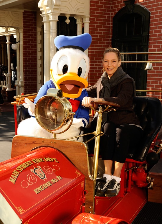 Award-Winning Actress Uma Thurman Poses with Donald Duck in the Famed 'Engine #71' Fire Engine on Main Street, U.S.A., at Magic Kingdom Park