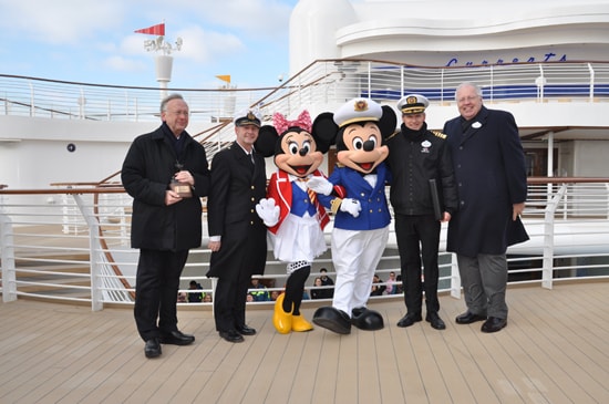  Mickey and Minnie Mouse with (from left to right) Bernard Meyer, managing partner of Meyer Werft, Captain Wolfgang Thos, also from Meyer Werft, Captain Tom Forberg, and Karl Holz, president of Disney Cruise Line