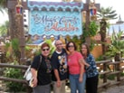 Nate and friends in front of the Magic Carpets of Aladdin attraction