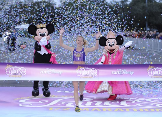 (FEB. 26, 2012): Rachel Booth, 31, of Mandeville, La., crosses the finish line to capture the 2012 Disney's Princess Half Marathon title Feb. 26, 2012 at Walt Disney World Resort in Lake Buena Vista, Fla. Booth, with an official time of 1:18:11, bested a field of 19,000 registered runners for the 4th annual 13.1-mile event. A record 27,000 athletes took part in a variety of Disney's Princess Half Marathon Weekend events, including a 5K race and a Health and Fitness Expo at ESPN Wide World of Sports Complex. Disney's Princess Half Marathon is part of the 'runDisney' series of endurance events that take place throughout the year at both Disneyland Resort in California and Walt Disney World Resort in Florida. (Preston Mack, photographer)