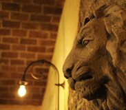 Detail of Stone Lion Head on Wall in Tutto Gusto in the Italy Pavilion at Epcot
