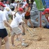 Volunteers shoveled mulch onto the playground as one of the final tasks of the day.