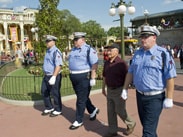 World War II Veteran and Purple Heart Recipient Louis Lessure Participates in the Flag Retreat Ceremony at Magic Kingdom Park