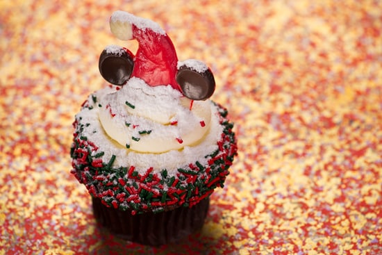 Gingerbread Cupcakes Topped with Cream Cheese Icing, Holiday Sprinkles and a Festive Minnie Mouse Hat, Available at Disney's Hollywood Studios