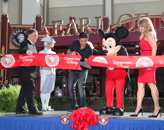 Earl of Sandwich co-founder Robert Earl, Mario Lopez and Mickey Mouse Cut the Ribbon to Celebrate the Opening of the First Earl of Sandwich Restaurant in California, Located in the Downtown District at the Disneyland Resort