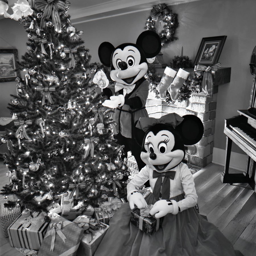 Mickey Mouse and Minnie Mouse trimming the Christmas tree in 1980