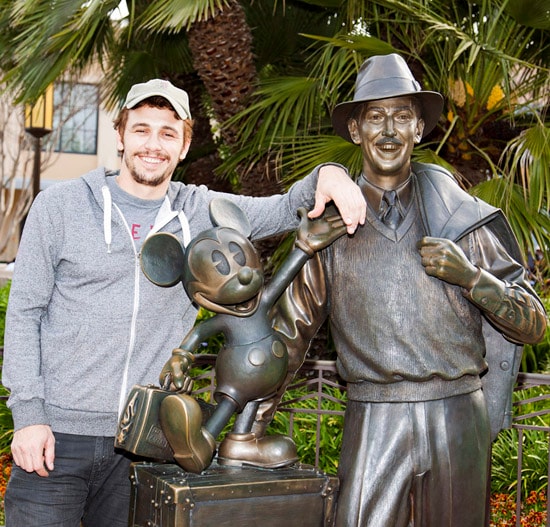 James Franco poses with the 'Storytellers' statue on Buena Vista Street