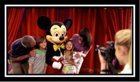 One of the Disneyland Paris PhotoPass Photographers capturing an amazing Meet & Greet moment with Mickey that will be cherished for a lifetime!