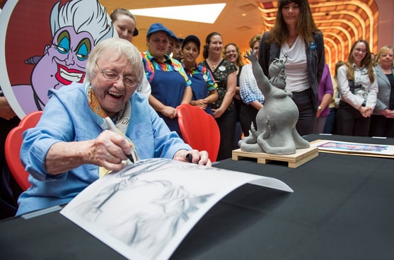 Actress Pat Carroll Adds Her Autograph to an Ursula Sketch on the Feature Chandelier at Disney’s Art of Animation Resort