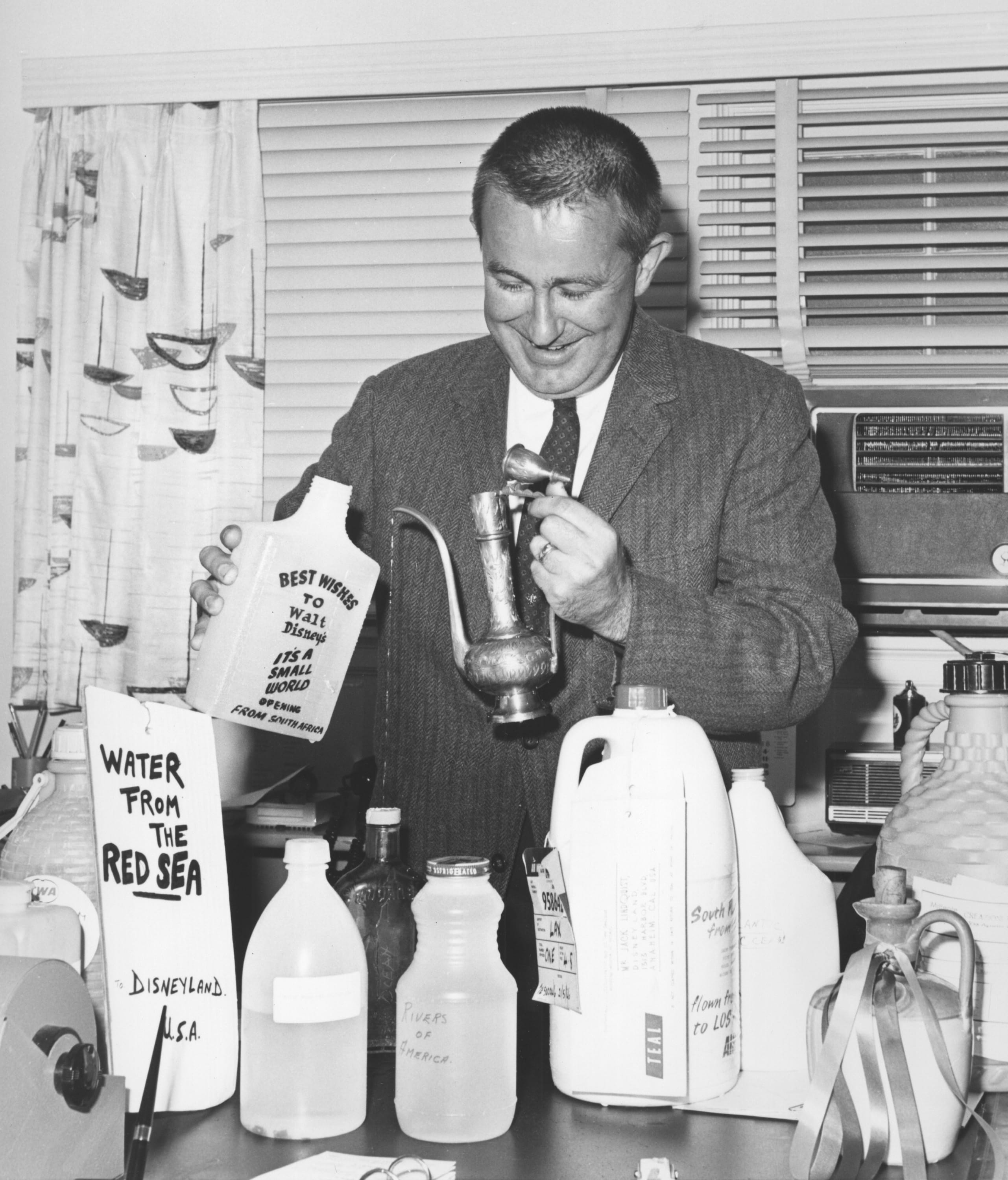  Caption: Jack Lindquist prepares water gathered around the world for the opening of ‘it’s a small world’ at Disneyland in 1966.