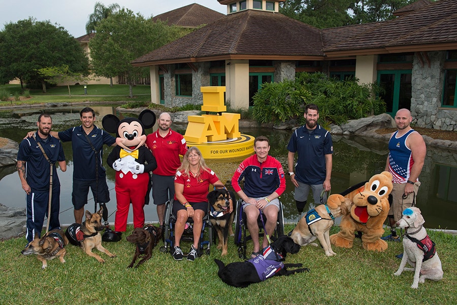 Mickey and Pluto visit some of the Invictus Games athletes and their dogs at the Shades of Green Hotel