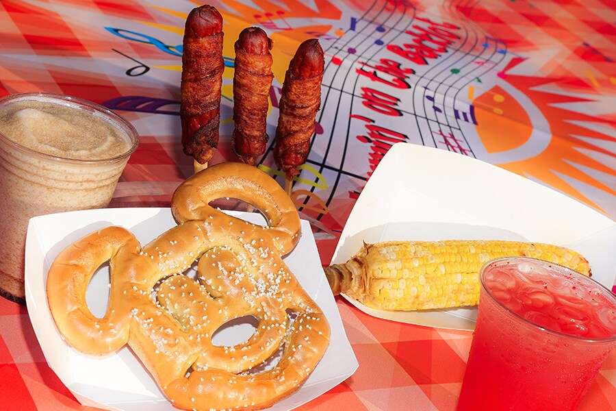 Mickey-shaped pretzels, “Wrap”sody in Bacon BBQ bacon-wrapped hot dogs and “Corn”certo on the Cob chili lime elote at JamminBacklot at Disney California Adventure Park