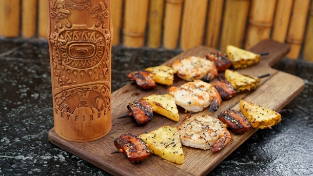 Moana Bamboo Sipper from Bengal Barbecue and Tiki Juice Bar in Disneyland Park, and Grilled Shrimp and Sausage Skewer from Bengal Barbecue