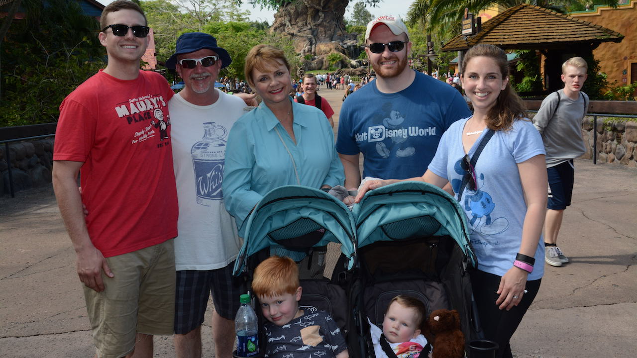 family at disney with double stroller