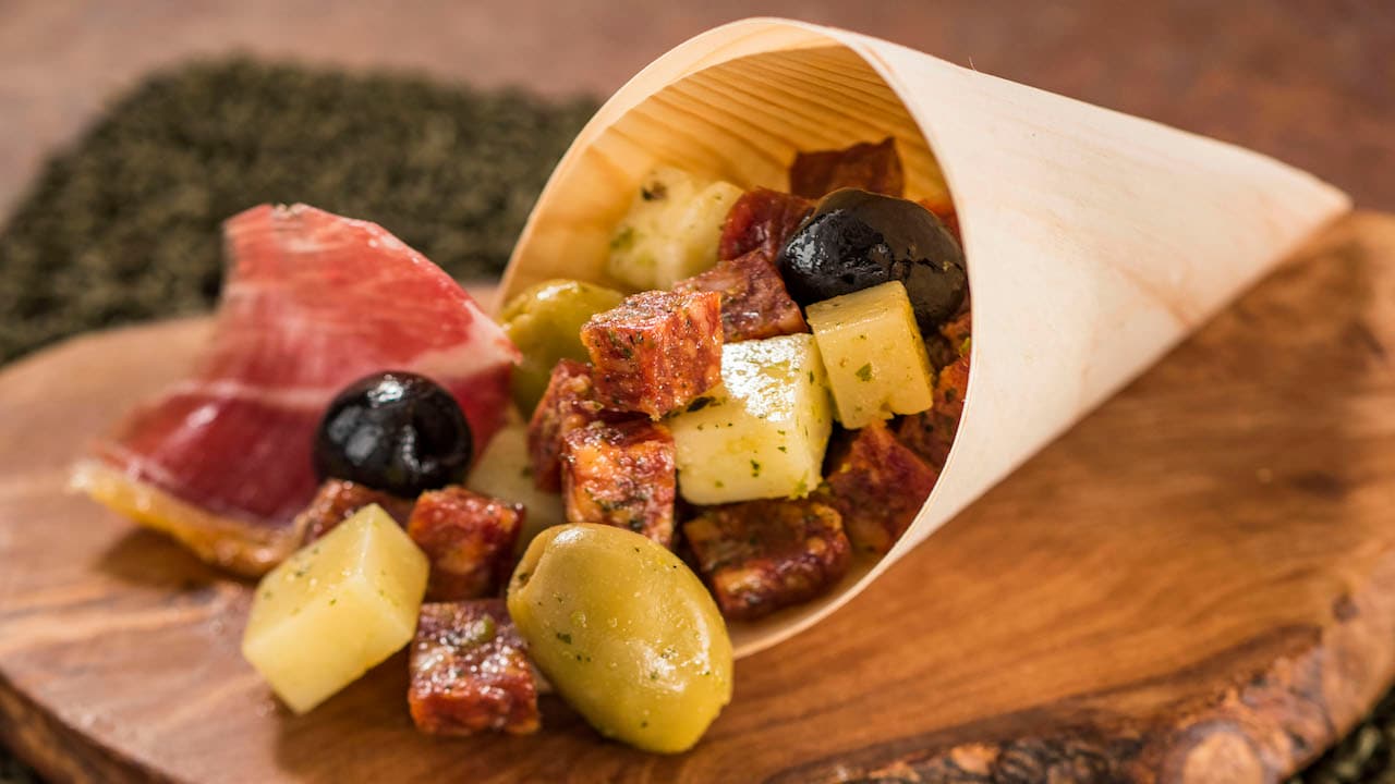 Charcuterie in a Cone with a selection of imported Spanish Meats, Cheeses, and Olives with an Herb Vinaigrette