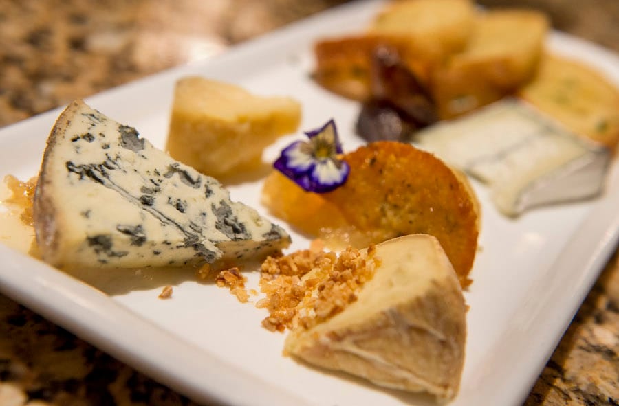 Artisan cheeses on a serving plate