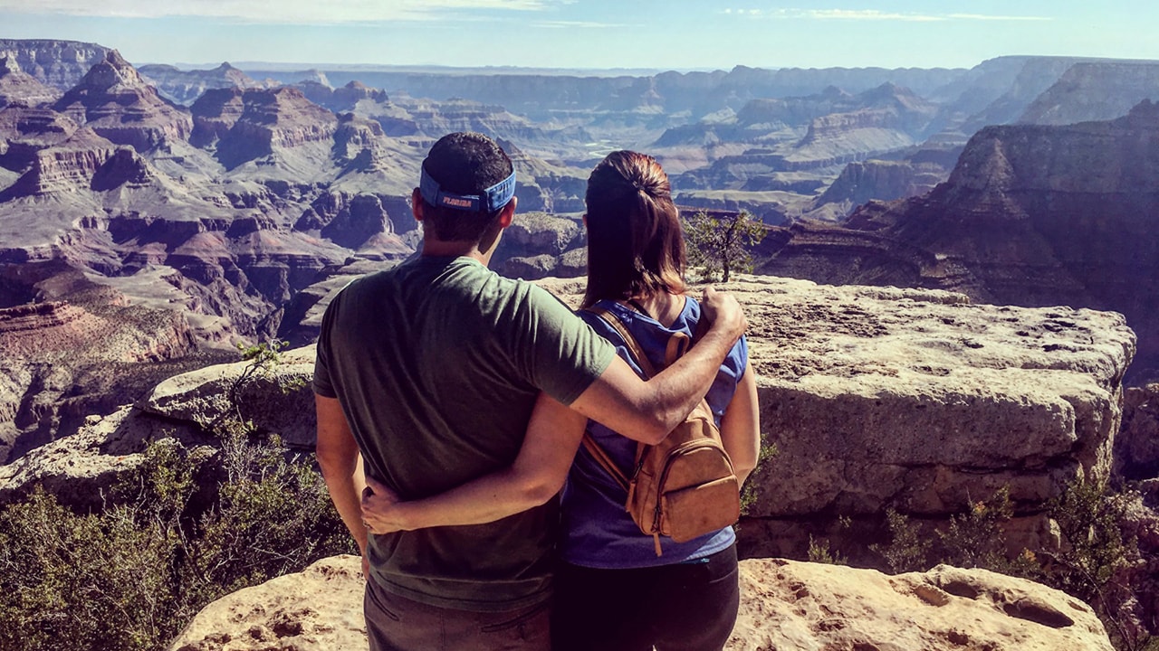 A couple viewing the Grand Canyon