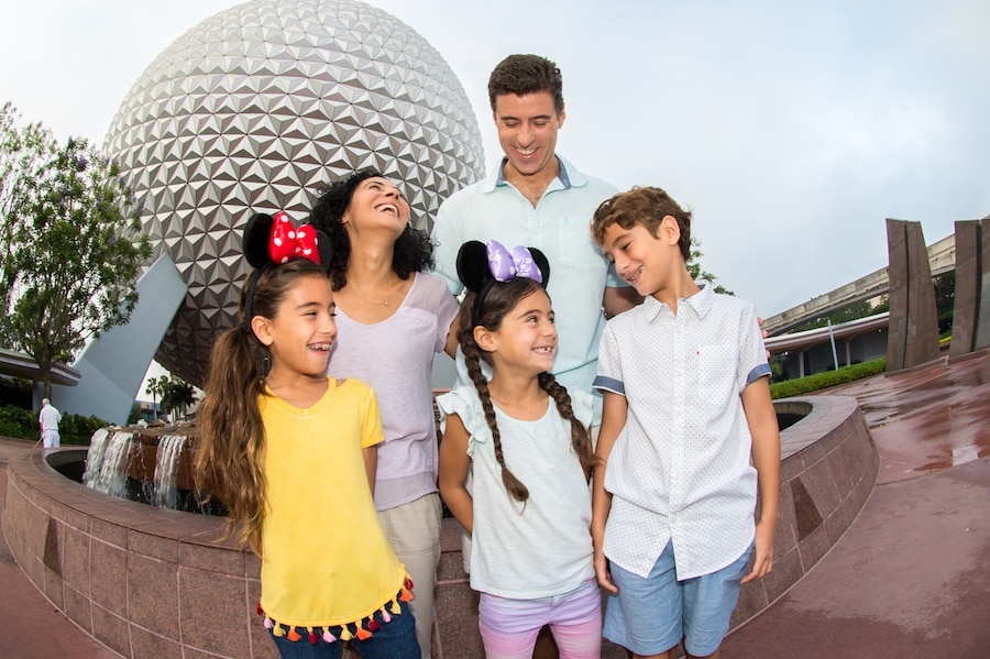 Family in front of Spaceship Earth at Epcot