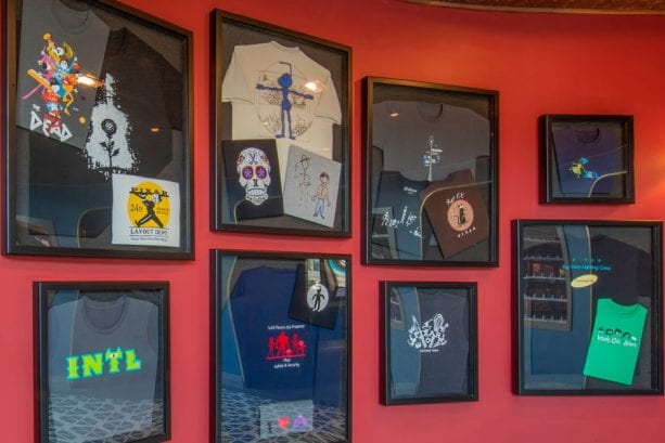 Wall of t-shirts in Lamplight Lounge at Disney California Adventure park