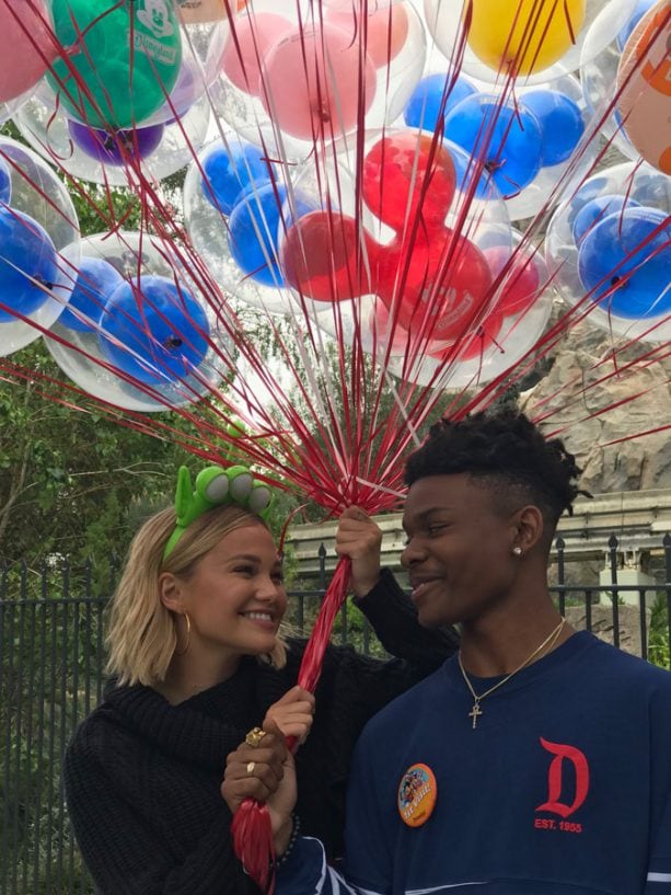 Freeform’s ‘Marvel’s Cloak & Dagger’ Stars Olivia Holt and Aubrey Joseph pose with balloons at Disneyland park
