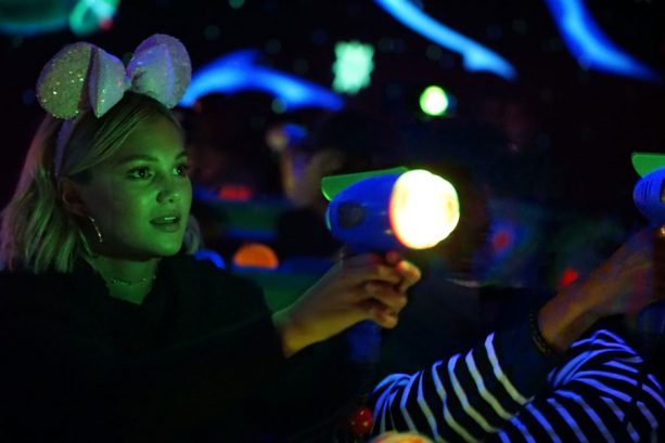 Freeform’s ‘Marvel’s Cloak & Dagger’ Stars Olivia Holt and Aubrey Joseph face off on Buzz Lightyear Astro Blasters at Disneyland park