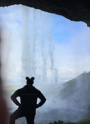 Traveler taking photo at Seljalandsfoss on Adventures by Disney Iceland Vacation