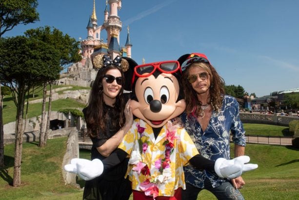 Liv and Steven Tyler pose with Mickey Mouse at Disneyland Paris